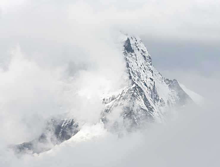 Switzerland, Valais, Zermatt, Matterhorn mountain seen through clouds